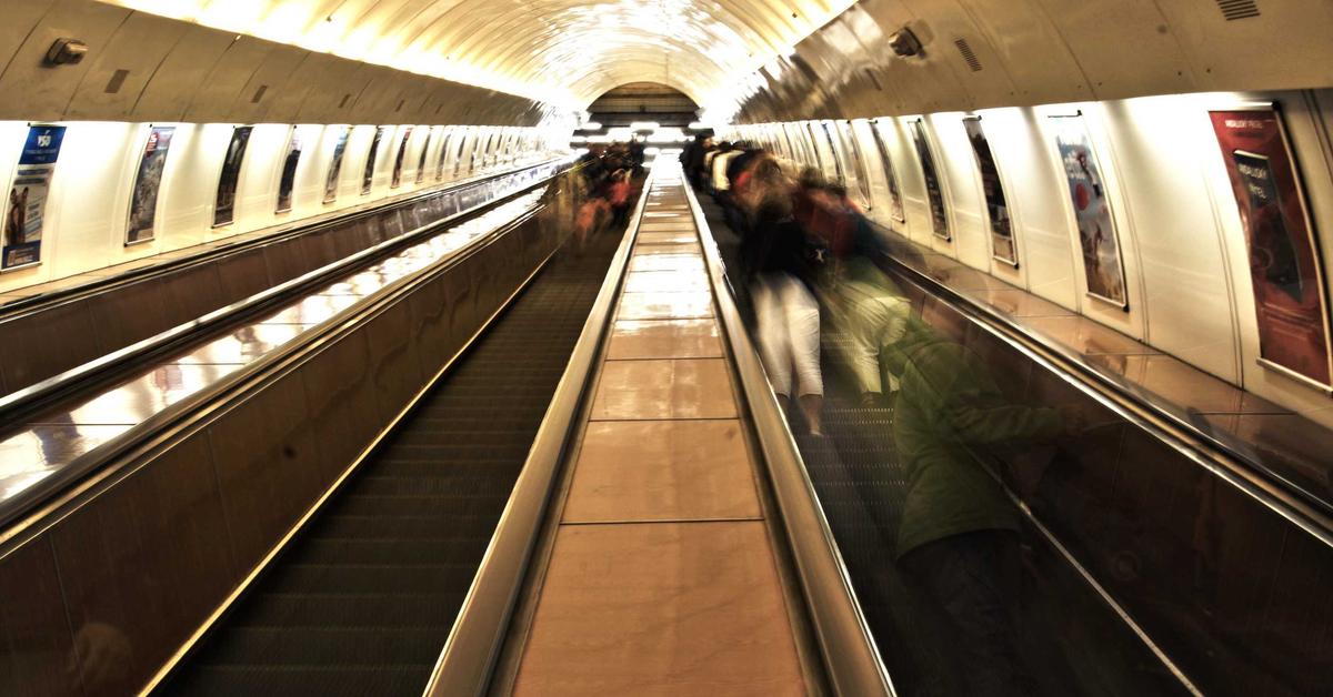 Person sitting anxiously watching clock representing waiting mode psychology and appointment anxiety